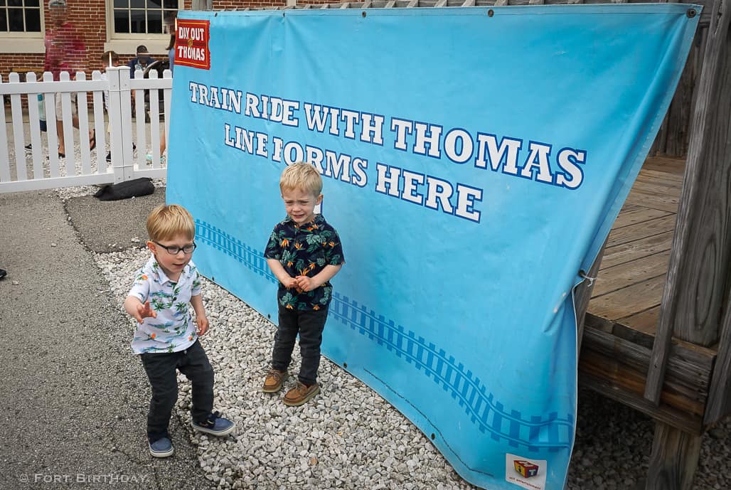 Twin brothers so excited to get in line for A day out with Thomas train ride Line forms here sign