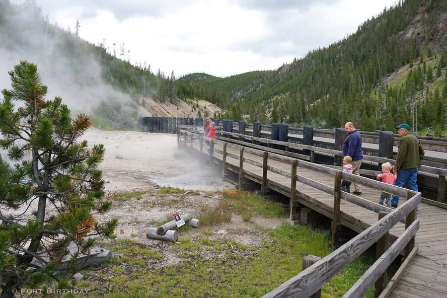 Family on boardwalk at Beryl Spring Yellowstone National Park