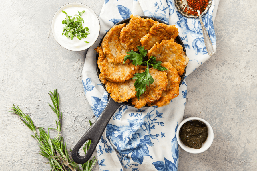 Latkes in a pan with sides are traditional for Hanukkah